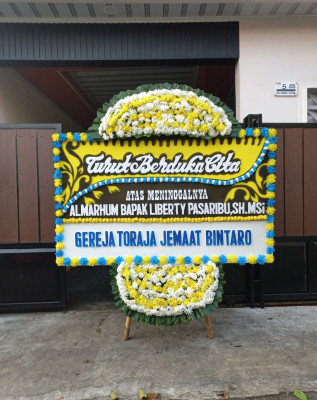 Papan Bunga Duka di Juai